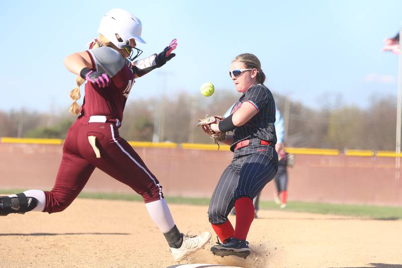 Morris’ Mylie Hughes is safe at first as Ottawa’s Kennedy Kane bobbles the throw on Wednesday, April 8, 2026 in Morris.