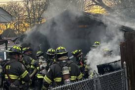 Crews battle Joliet garage fire