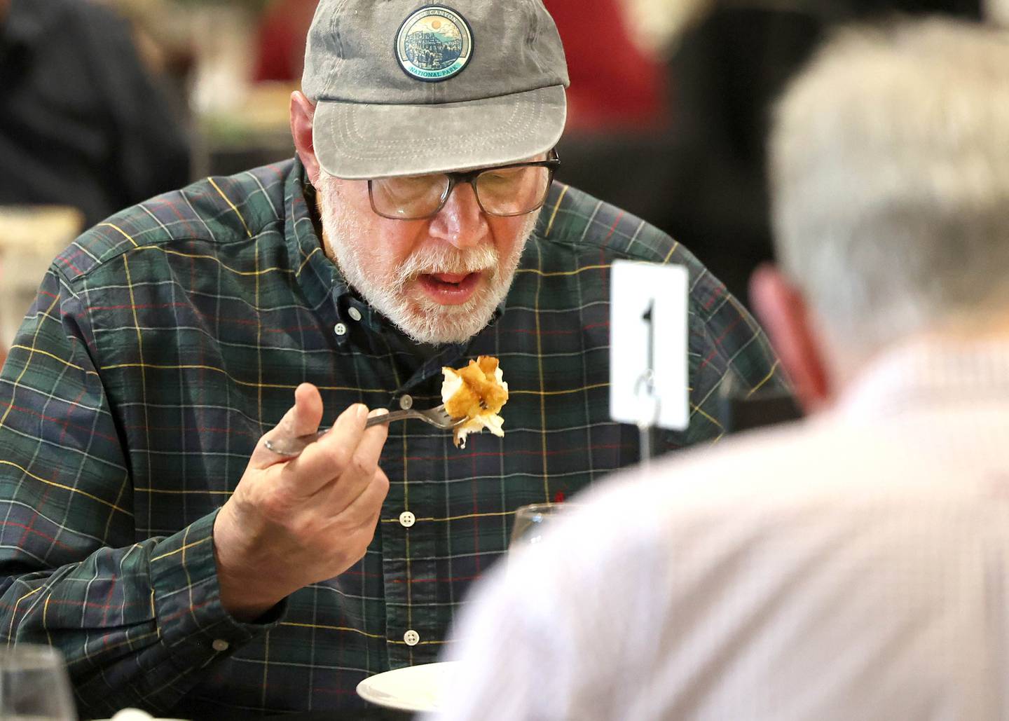 Lyle Wolff gets a forkful of fish Friday, March 20, 2026, during the annual Lenten season fish fry at Faranda’s Banquets in DeKalb. The fish fries are 4 to 8 p.m. Fridays through April 3 at the banquet center and a portion of the procedes go to support multiple social service agencies in DeKalb County.