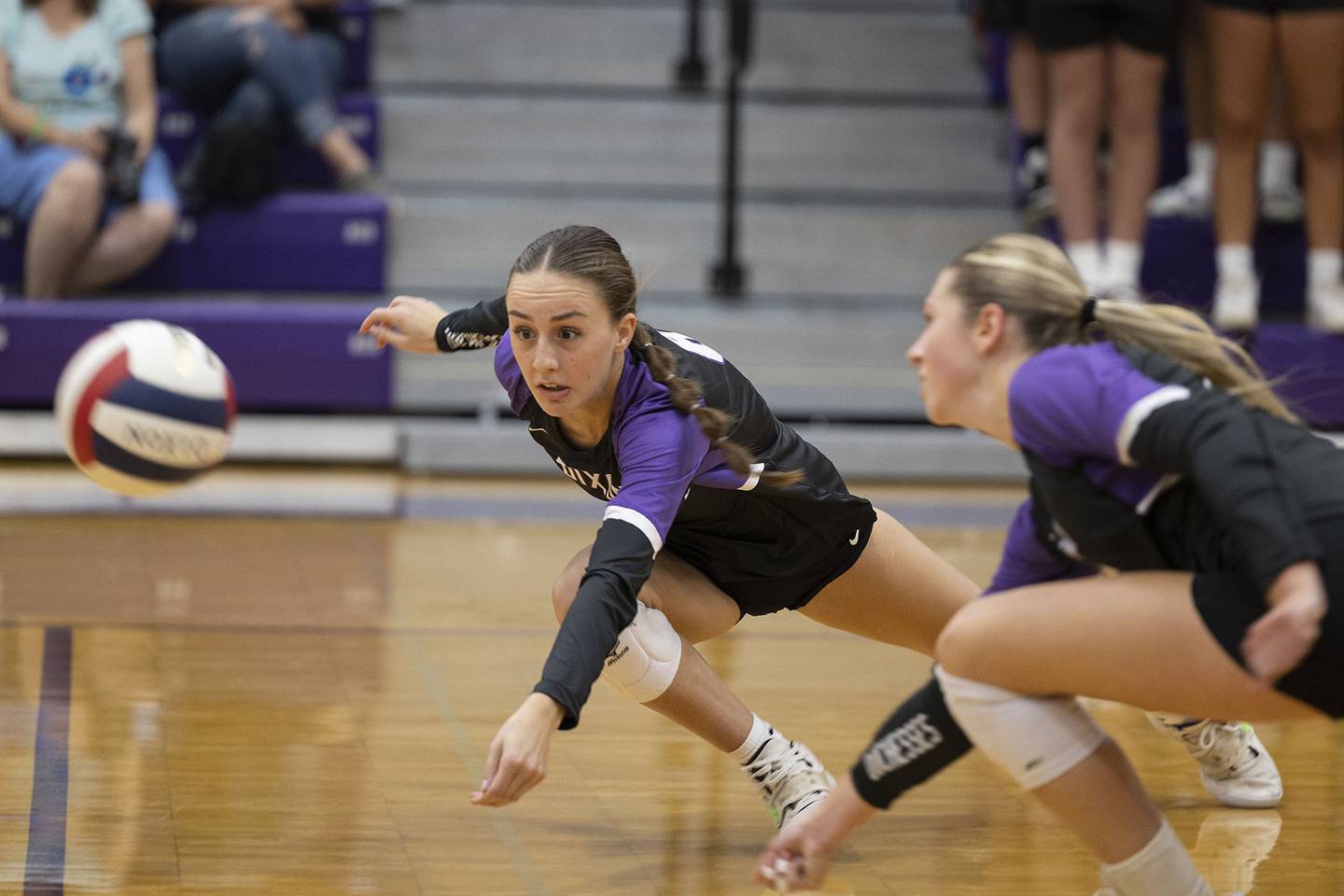 Dixon’s Caroline Childers (left) and Morgan Hargrave both dive for a shot against Sterling Tuesday, Aug. 27, 2024, at Dixon High School.
