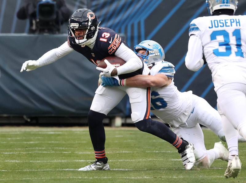 Chicago Bears wide receiver Keenan Allen tries to pull away from Detroit Lions linebacker Jack Campbell during their game Sunday, Dec. 22, 2024, at Soldier Field in Chicago.