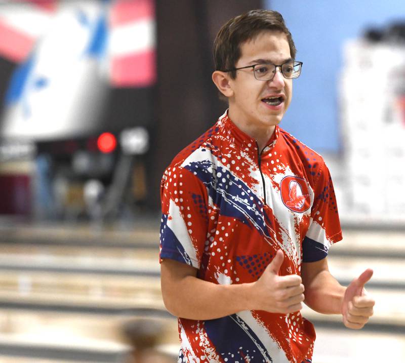 Oregon's Caleb Ehrler gives a thumbs up after rolling a strike during a match with Harvard at Town & Country Lanes in Mt. Morris on Friday, Dec. 19, 2025.