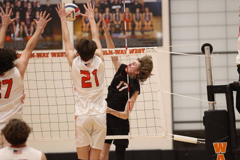 Lincoln-Way West’s Connor Jaral hits a shot down the line against Plainfield East on Wednesday, March 22nd. 2023 in New Lenox.