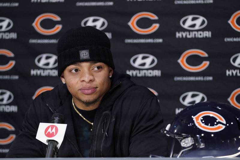 Chicago Bears quarterback Justin Fields listens to a question during a news conference, Monday, Jan. 31, 2022, at Halas Hall in Lake Forest.