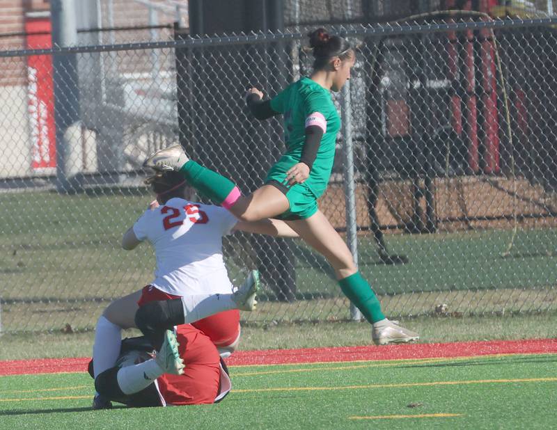 L-P's Vicky Tejada leaps over Streator's Jillian Clift as keeper Leia Gammie traps the ball out side of the box on Friday, March 27, 2026 at the L-P athletic complex in La Salle.