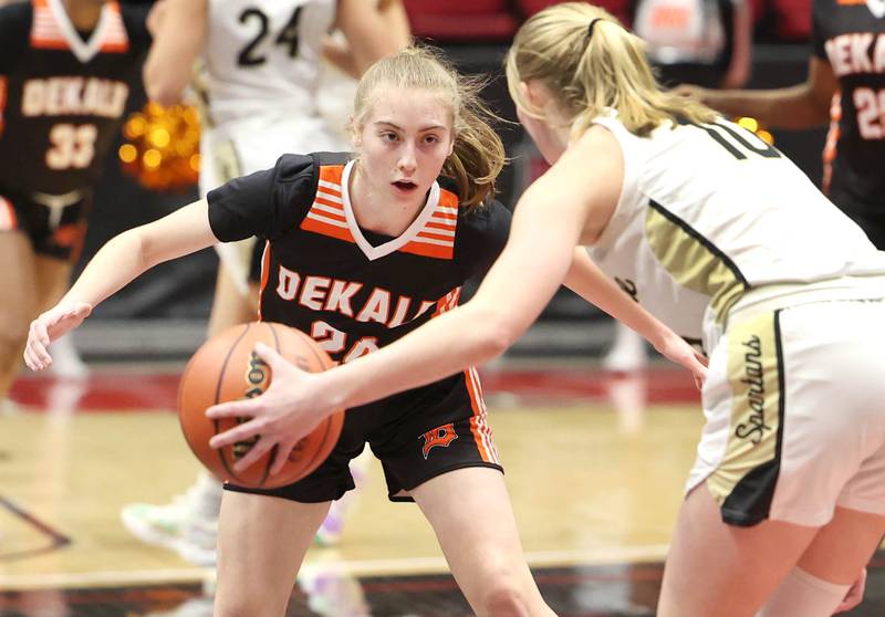 DeKalb’s Olivia Schermerhorn plays defense against Sycamore's Lexi Carlsen during the First National Challenge Friday, Jan. 27, 2023, at The Convocation Center on the campus of Northern Illinois University in DeKalb.