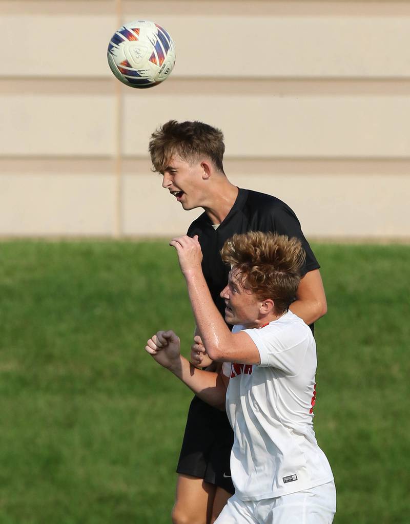 Sycamore's Charlie Roots and Ottawa's Evan Snook go up for a header during their game Wednesday, Sept. 14, 2022, at Sycamore High School.