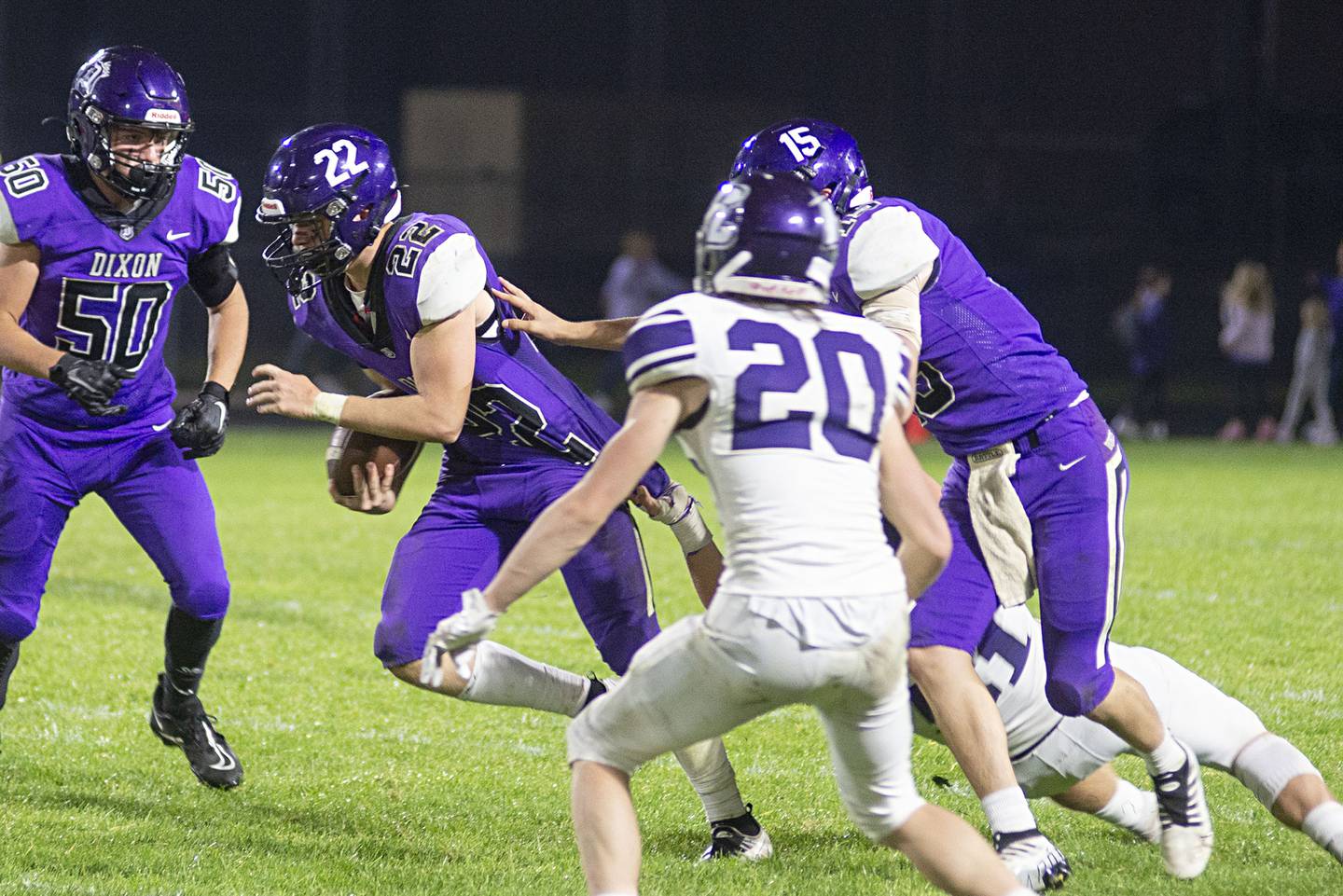 Dixon’s Aiden Wiseman fights for yards against Rockford Lutheran Friday, Sept. 30, 2022.