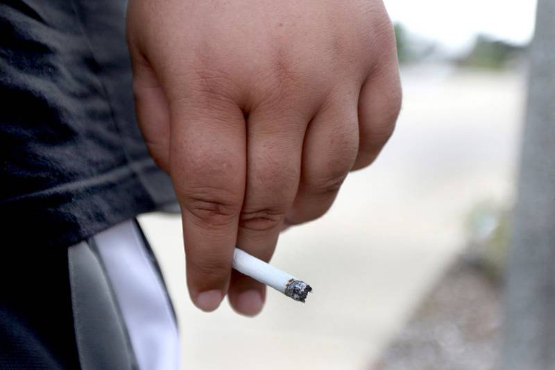 Portions of the northern side of Lucinda Avenue are city owned, giving tobacco-using NIU students a space to smoke close to campus.