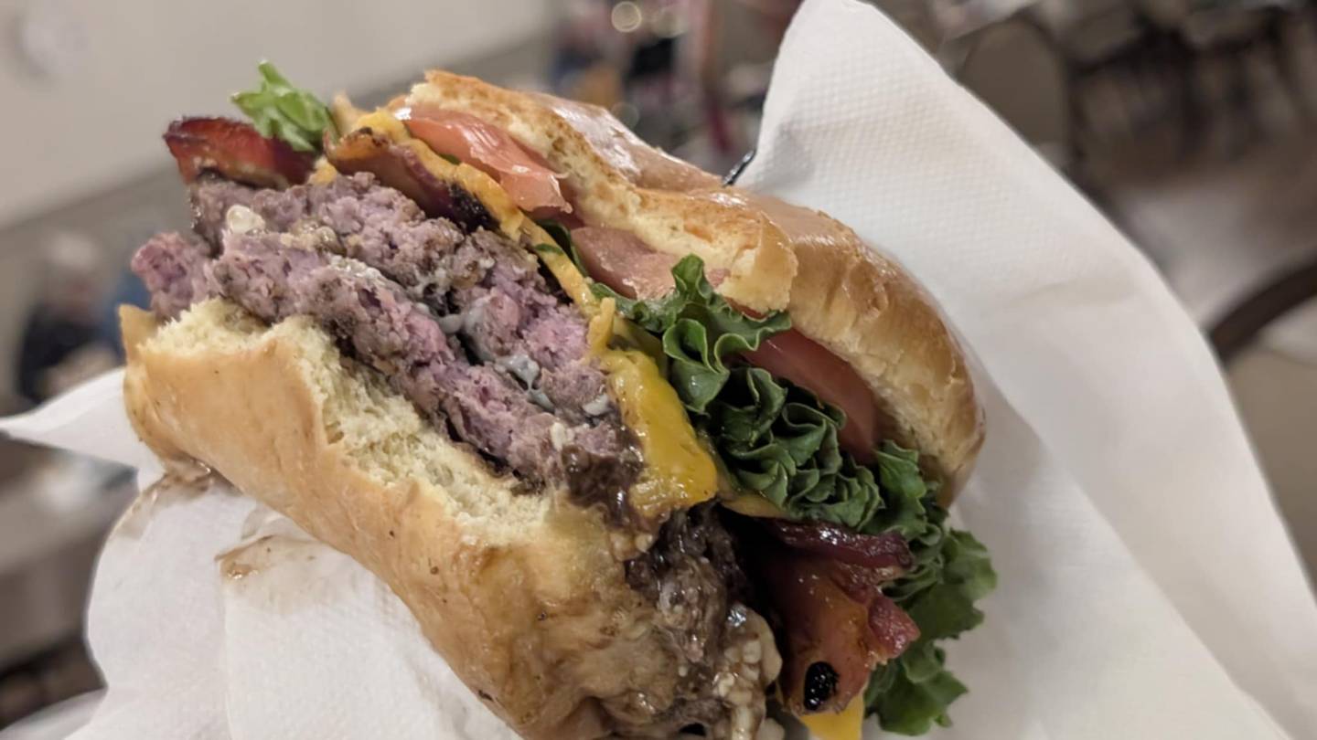 Tom Grotovsky, owner of The Curator’s Café inside the inside the American Legion Post 1080 in Joliet, created a special bluegrass burger for his Bluegrass Burger Bash Day, which is seen on Wednesday, April 30, 2025, in Joliet.