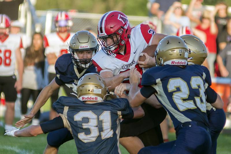 Amboy’s Quinn Leffelmann takes on a host of Marcos Friday, Aug. 26, 2022 in Polo.