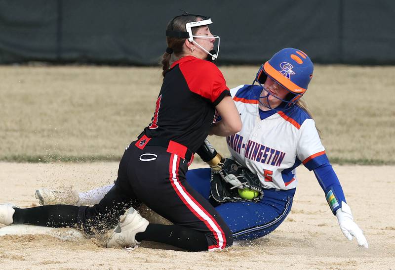 Indian Creek’s MaKenna Barshinger collides with Genoa-Kingston’s Abigail Fellows as she is tagged out trying to steal second during their game Tuesday, March 18, 2025, at Indian Creek High School in Shabbona.