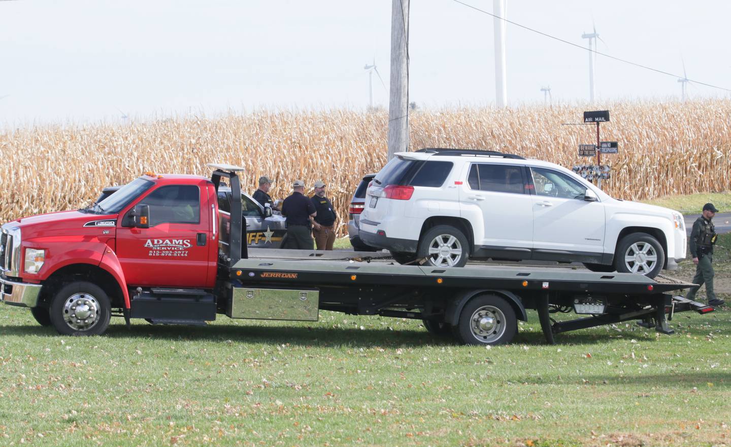 A tow truck departs the scene with a vehicle of an incident in the 200 block of E. Long Street on Monday, Oct. 24, 2022 in Ohio, Ill. A suspect is in custody and there is no longer a threat to the community, the Bureau County Sheriff’s Office told Ohio Community School District.