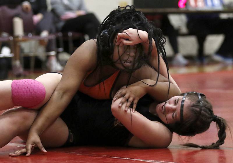 DeKalb’s Kayden Johnson tries to control Morris’ Nicolette Boleman in the 155-pound match of a nononference wrestling meet on Wednesday, Jan. 22, 2025, at Huntley High School.