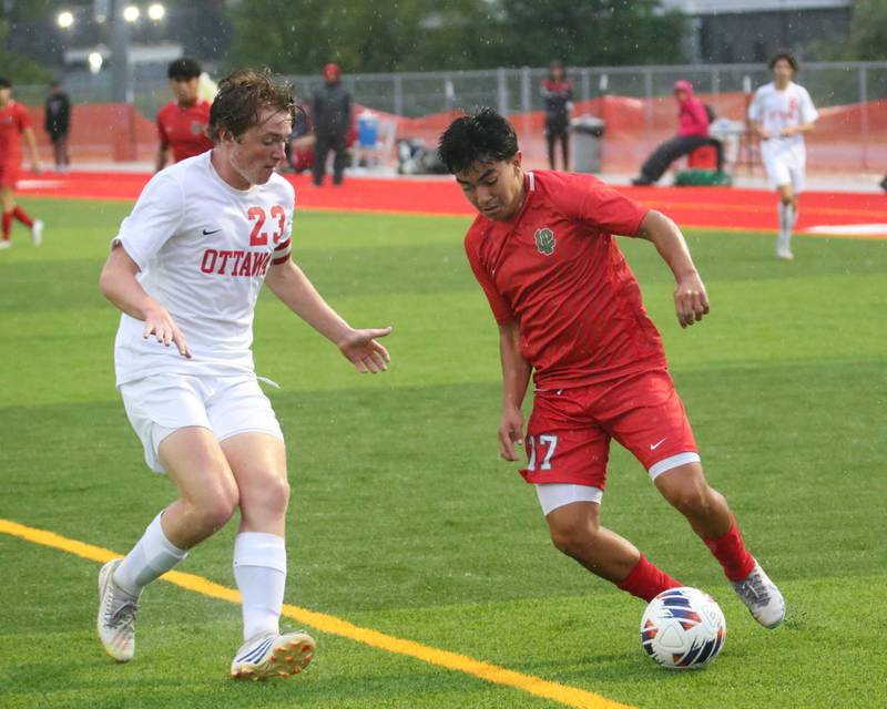 L-P's Isamel Mejia keeps the ball away from Ottawa's Evan Snook on Monday, Sept. 11, 2023 at the L-P Athletic Complex in La Salle.