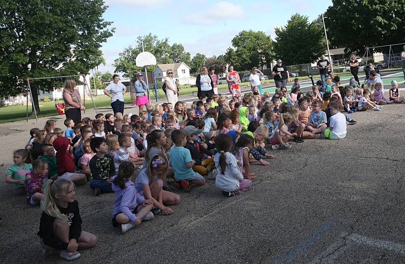 Kindergartners and preschoolers from Douglas Elementary chant "Mr Bob" in support of their custodian Bob Espel during his head and beard shaving on Wednesday, May 22, 2024 at Douglas Elementary School in Princeton. Students raised more than $3.332 in the past few weeks. All proceeds will go to the new landscaping around the Douglas building, with the first round of plantings to take place with students present this Thursday, May 23. Using funds from the Preschool for All grant, the school has purchased new age-appropriate playground equipment to promote physical activity, creativity and social interaction. To coincide with the arrival of the new playground equipment, the school is seeking help from the community to improve and enhance the existing landscaping by adding new plants and flowers around the building’s exterior. This isn’t the first time Espel has used a beard shaving to motivate a student fundraiser. In the spring of 2021, Espel challenged the Douglas community to raise money for the Bureau County Food Pantry and collected more than $3,000 by trading his famous beard in for spare change.