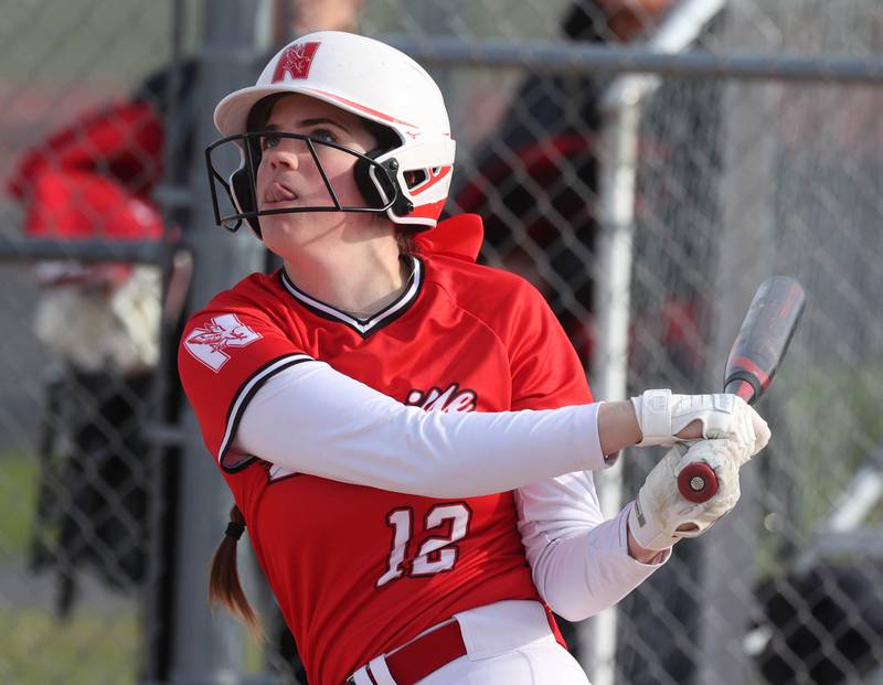 Naperville Central's Shea Meech watches the flight of her hit Wednesday, April 16, 2025, during their game at DeKalb High School.