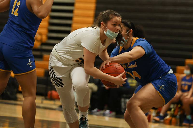Joliet West’s Grace Walsh battles under the basket against Joliet Central. Tuesday, Feb. 8, 2022, in Joliet.