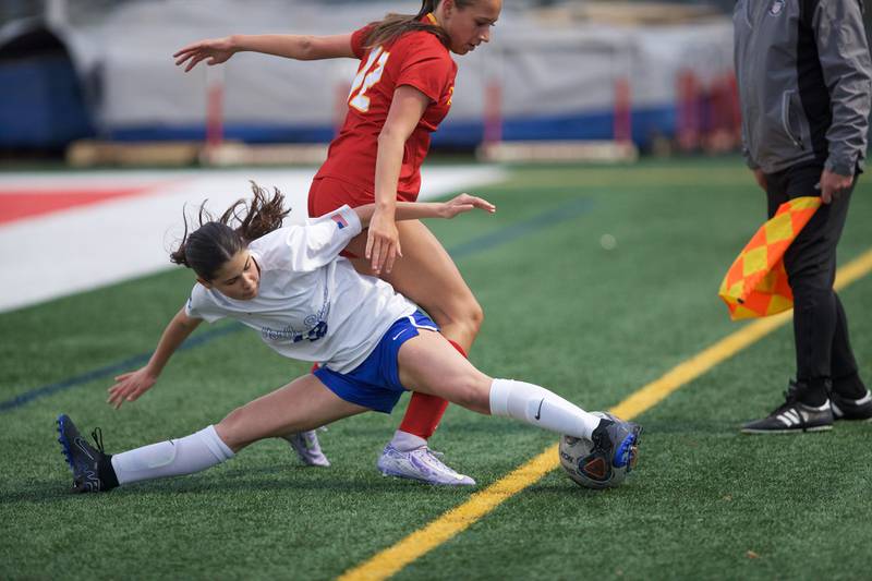 Batavia's Alexis Crouch battles for the ball with St. Charles North's Shanahan Madi  on Thursday, April 17,2025 in Batavia.