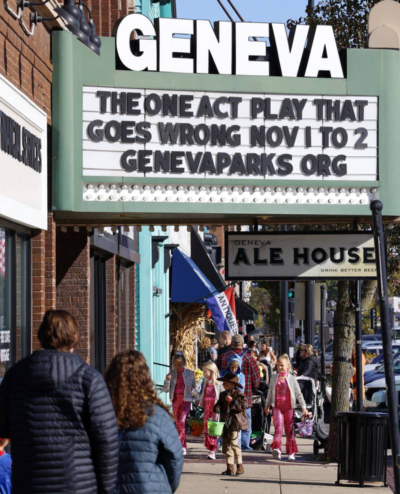 Families trick-or-treat Thursday, Oct. 30, 2025 in downtown Geneva.