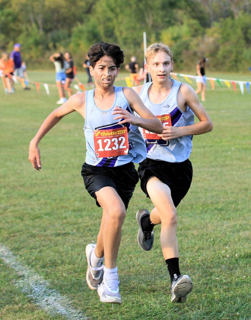 Rochelle's Sami Aljabari (left) and Tyler Sutton (right) run during a cross country meet at Skare Park.
