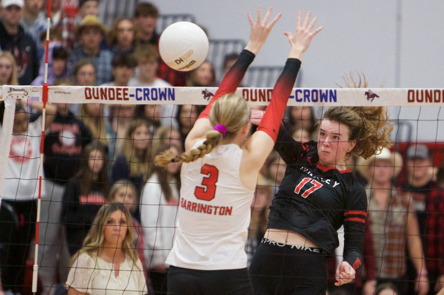 Huntley's Georgia Watson sends a kill shot past Barrington's Hope Regas at the Class 4A Super Sectional Final on Friday, Nov. 4,2022 in Dundee.