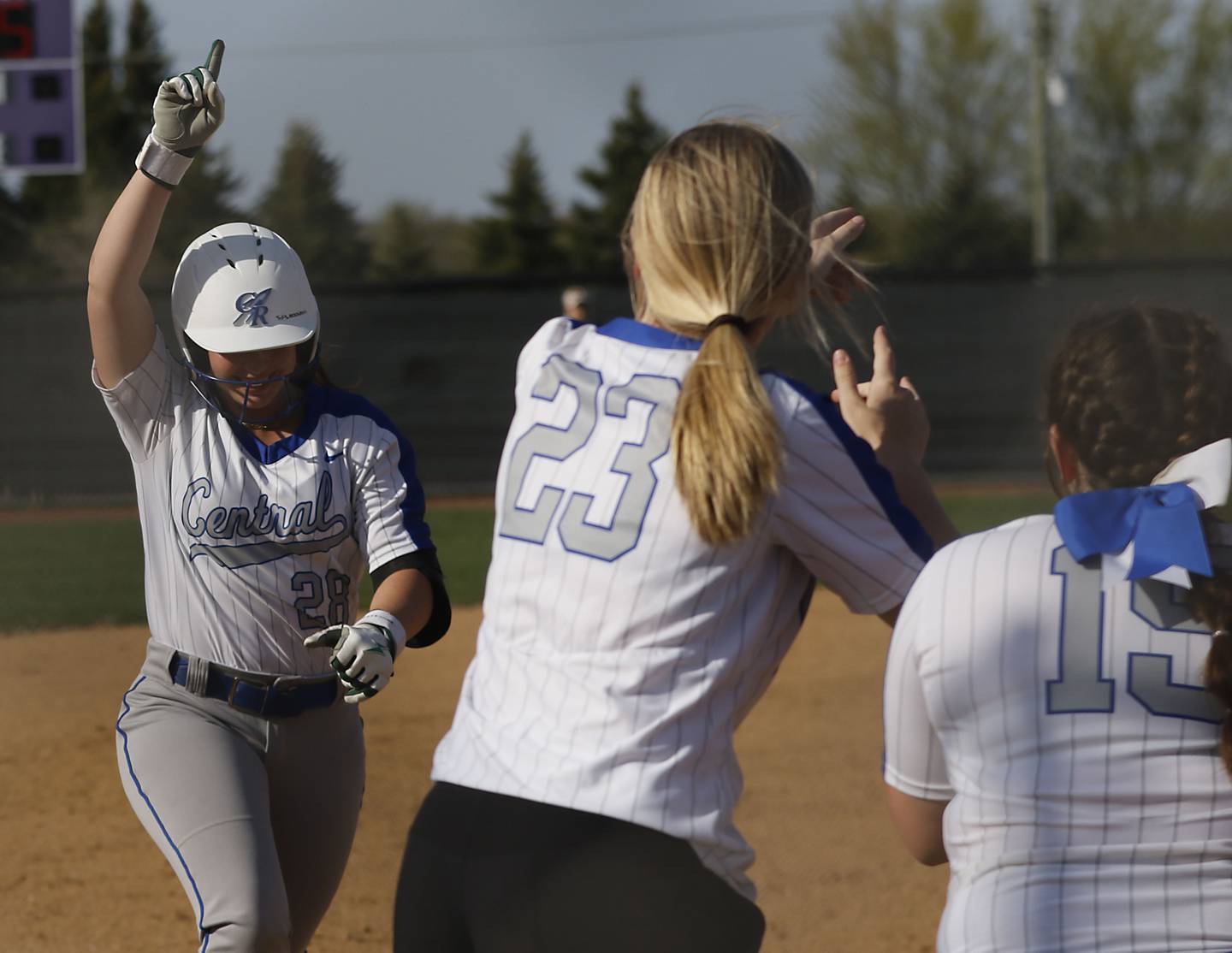 Burlington Central's Alexis Skarda celebrates a home run during a Fox Valley Conference softball game against Hampshire on Tuesday, April 21, 2026, at Hampshire High School.