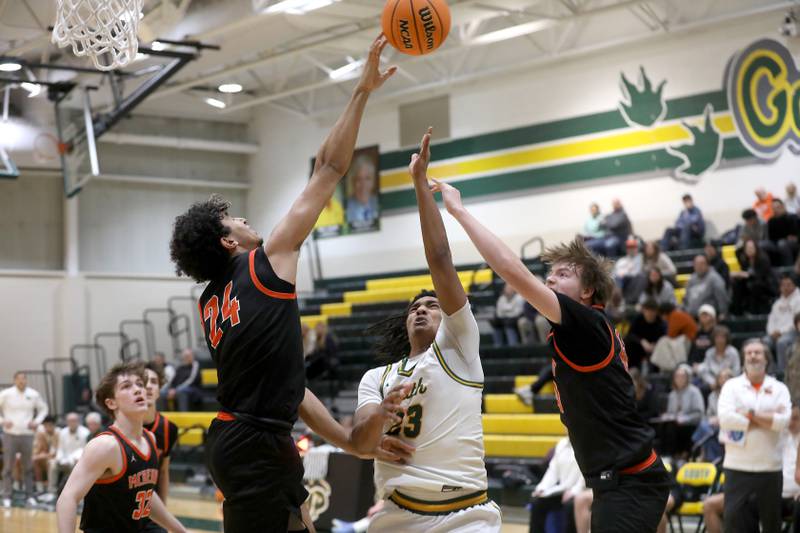 McHenry's Adam Anwar blocks the shot of Crystal Lake South's David Mcfadden as McHenry's Nate Ottaway tries to help out on the play during a Fox Valley Conference boys basketball game on Wednesday, Jan. 14, 2026, at Crystal Lake South High School.