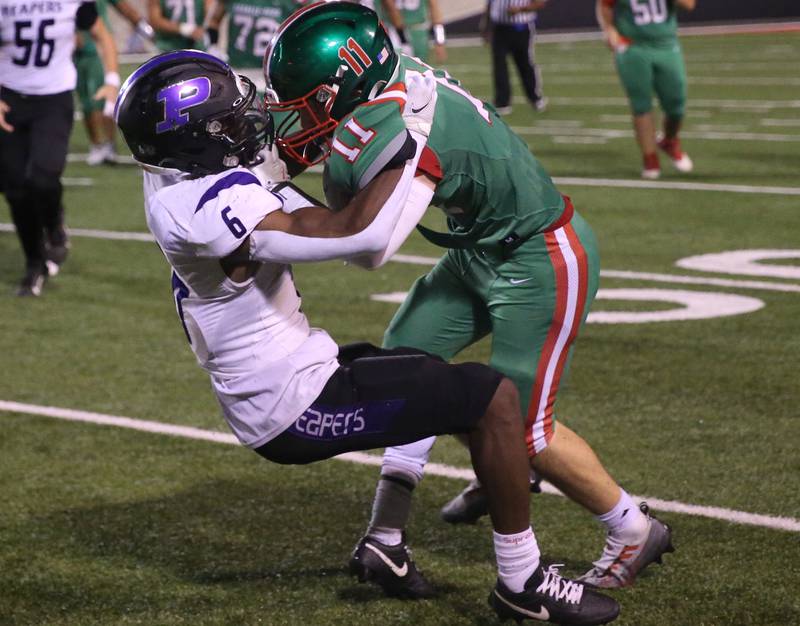 Plano's Waleed Johnson takes down L-P's Kaleb Kennedy on a run on Friday, Sept. 15, 2023 at Howard Fellows Stadium.