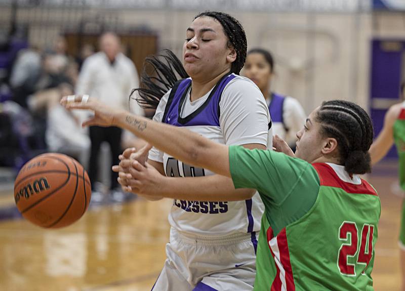 Dixon’s Hallie Williamson has the ball knocked away by LaSalle-Peru’s Jasmine Garman Thursday, Nov. 30, 2023 in Dixon.