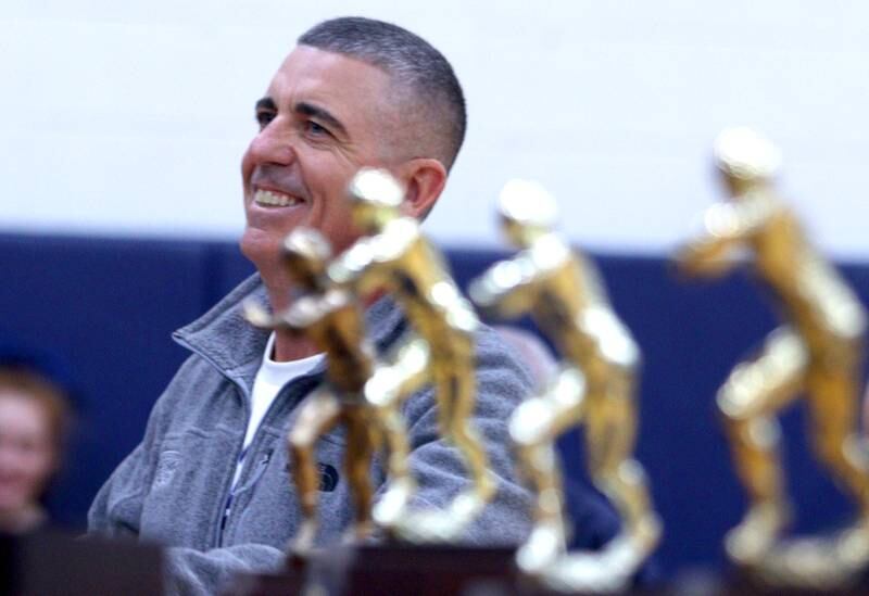 Head Coach Brad Seaburg addresses the audience during a celebration of the IHSA Class 6A Cary-Grove football team at the high school Sunday.