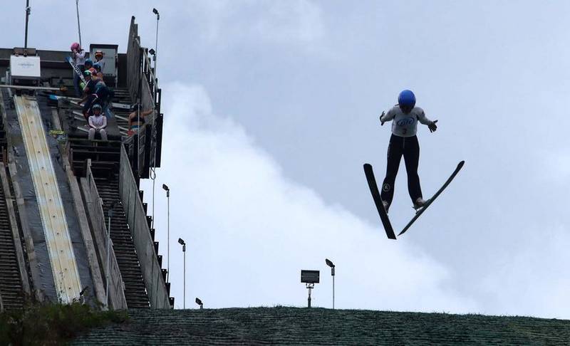 A jumper soars during the warm-up round of "Jumptoberfest" Sunday, Oct. 3, 2021, at Norge Ski Club in Fox River Grove.