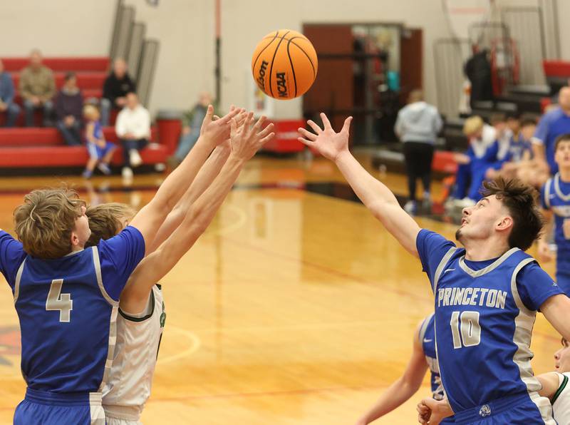 Princeton's Julian Mucha and Gavin Lanham reach out to grab a rebound against Eureka during the Colmone Classic on Thursday, Dec. 11, 2025 at Hall High School.