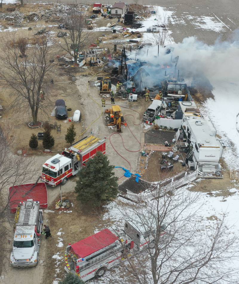 Firefighters extinguish flames from a structure fire in the 4000 block of East 16th Road on Thursday, Feb. 5, 2026 near Earlville. Fire departments from Serena, Mendota, Troy Grove and others were dispatched shortly after 12p.m. to the fire. The fire was upgraded to the second alarm through the Mutual Aid Box Alarm System (MABAS 25) shortly after.