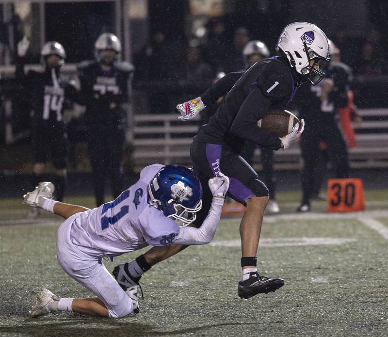 Newman’s Parker Strommen is unable to haul down El Paso’s Braden Gibson Saturday, Nov. 8, 2025.