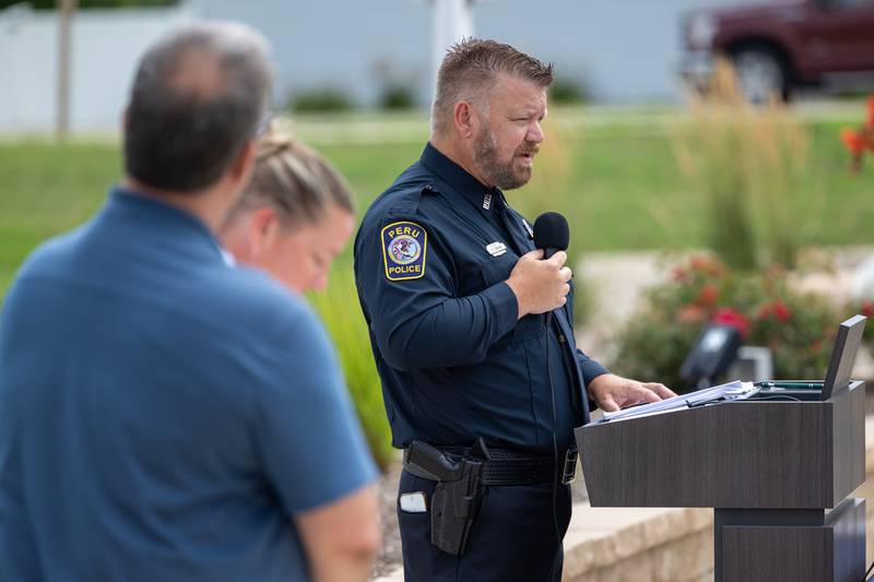 School Resource Officer Brian Zebron announces graduates at the Juvenile Police Academy graduation ceremony on Friday, July 25, 2025 at the Peru Police Department in Peru.