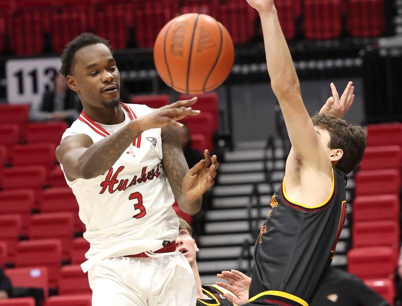 Northern Illinois guard Daemar Kelly passes the ball around a Louisiana-Monroe defender Monday, Nov. 3, 2025, during their game at the Convocation Center at NIU in DeKalb.