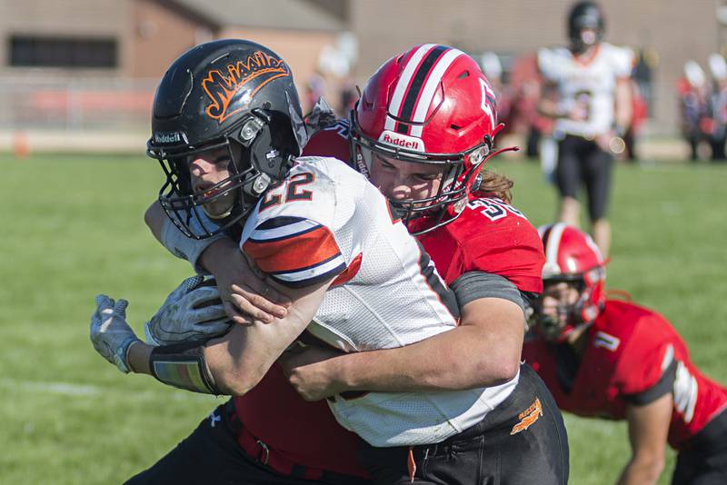 Milledgeville’s Ashton Nobis is tackled by Amboy's Joe Quest Saturday, Nov. 6, 2021.