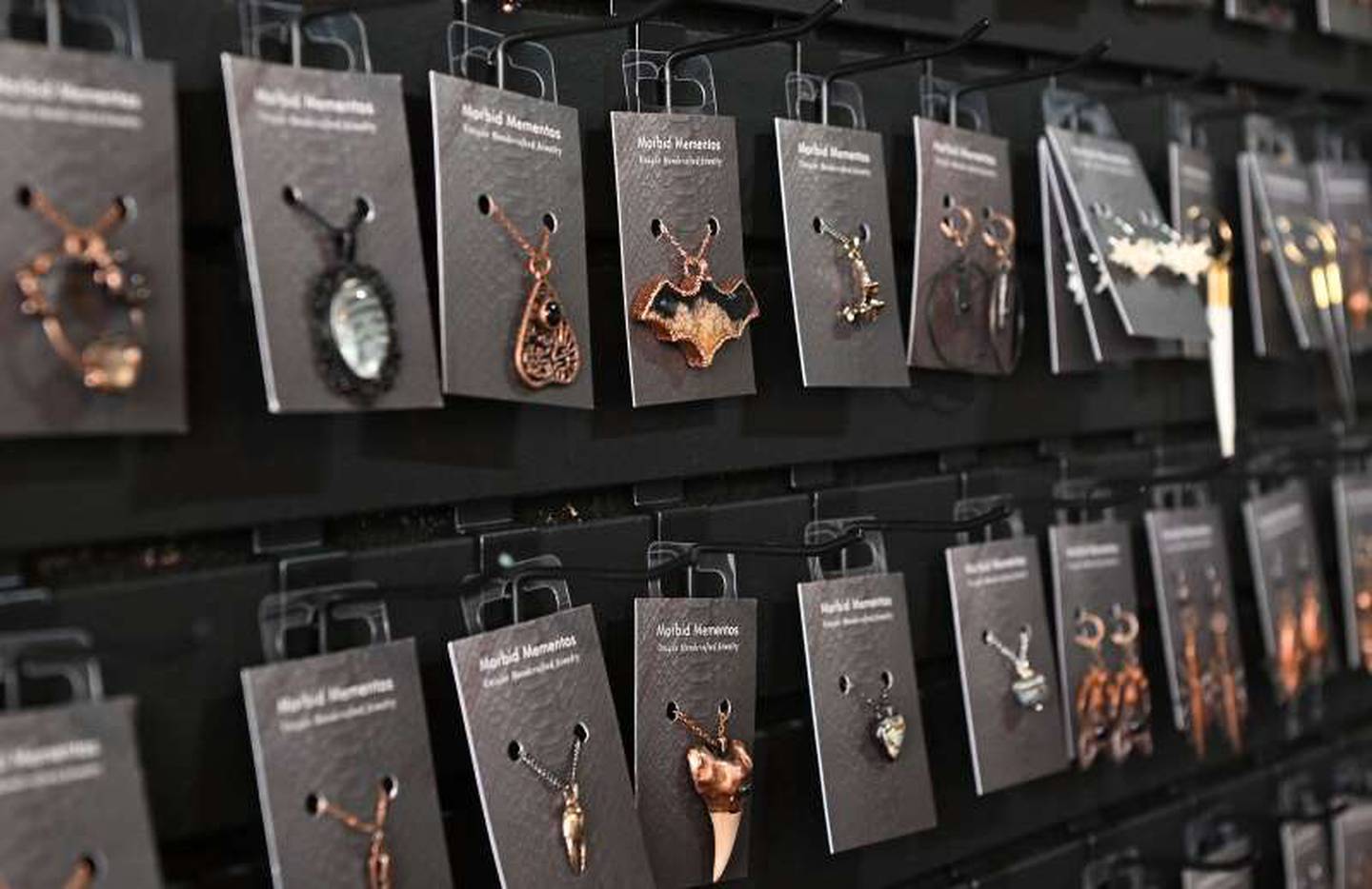 Owner Kelli Naughton makes much of the jewelry available at Morbid Mementos in Elgin.