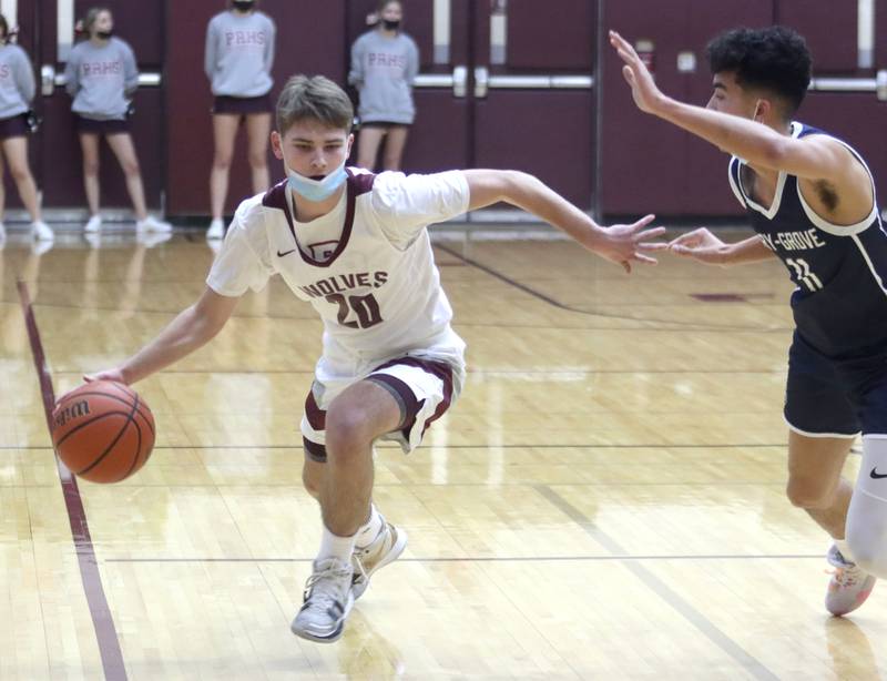 Prairie Ridge’s Jackson Otto moves the ball against Cary-Grove during boys varsity basketball action in Crystal Lake Tuesday night.