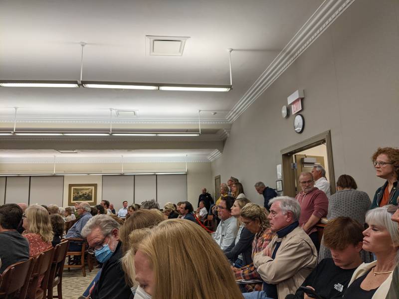 St. Charles residents packed the City Council chambers Monday night to hear about two redevelopment proposals for the former St. Charles police station site along the Fox River.