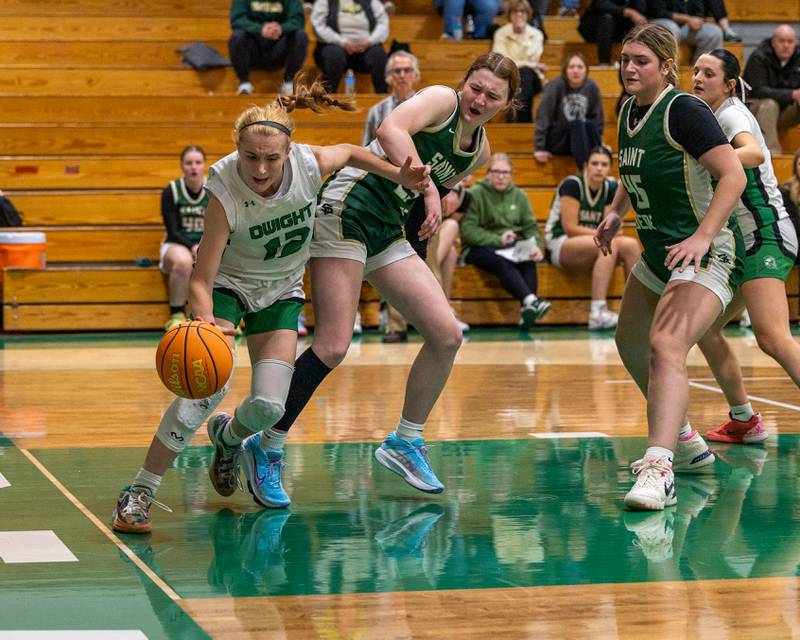 Dwight's Mikayla Chambers (12) pushes away Lili McClain (23) of St. Bede whilst driving towards basket on Monday, January 19, 2026 at the Krese Memorial Gymnasium in Dwight.