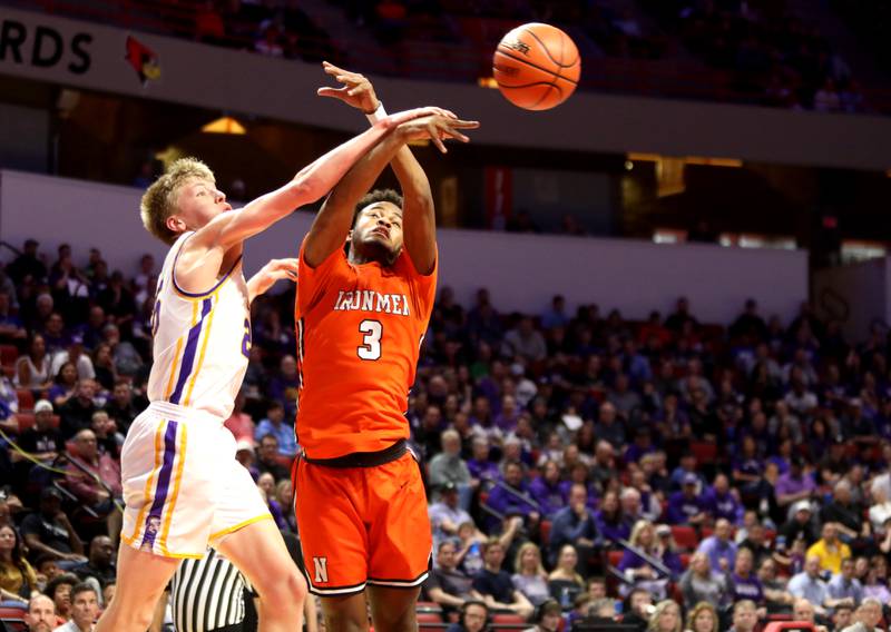 Downers Grove North’s Alex Miller (left) and Normal Community’s Conner Smith go after a rebound during the Class 4A Normal Supersectional game on Monday, March 4, 2024.