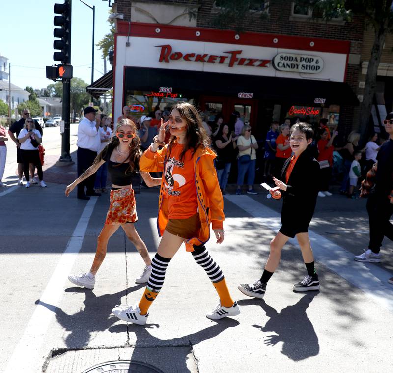 St. Charles East students participate in the school’s homecoming parade on Main Street through Downtown St. Charles on Thursday, Aug. 31, 2023.