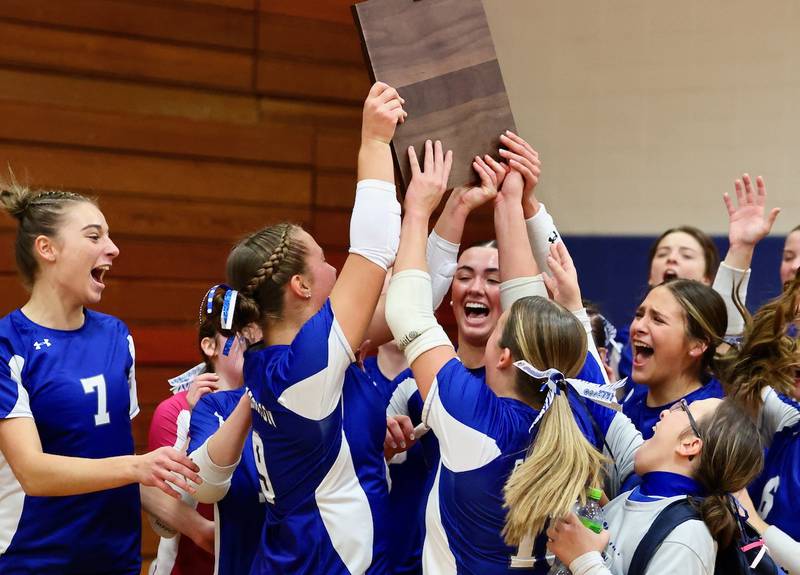 The Princeton Tigresses celebrate their regional championship win over Sterling Newman Thursday night at Prouty Gym.
