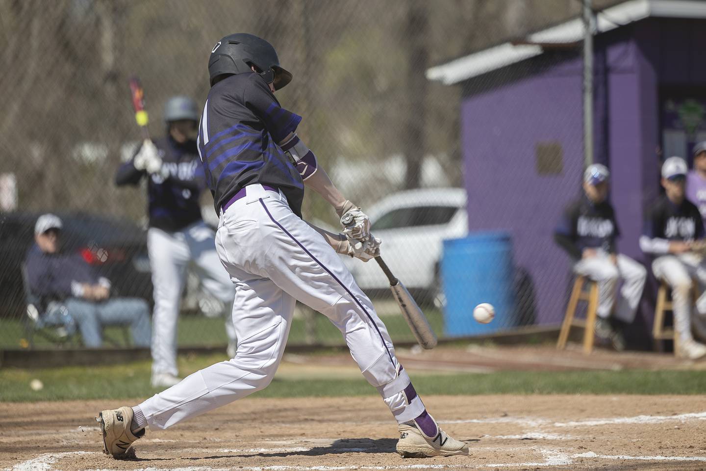 Dixon’s James Leslie drives the ball for an RBI against Newman Saturday, April 13, 2024 at Veterans Memorial Park in Dixon.