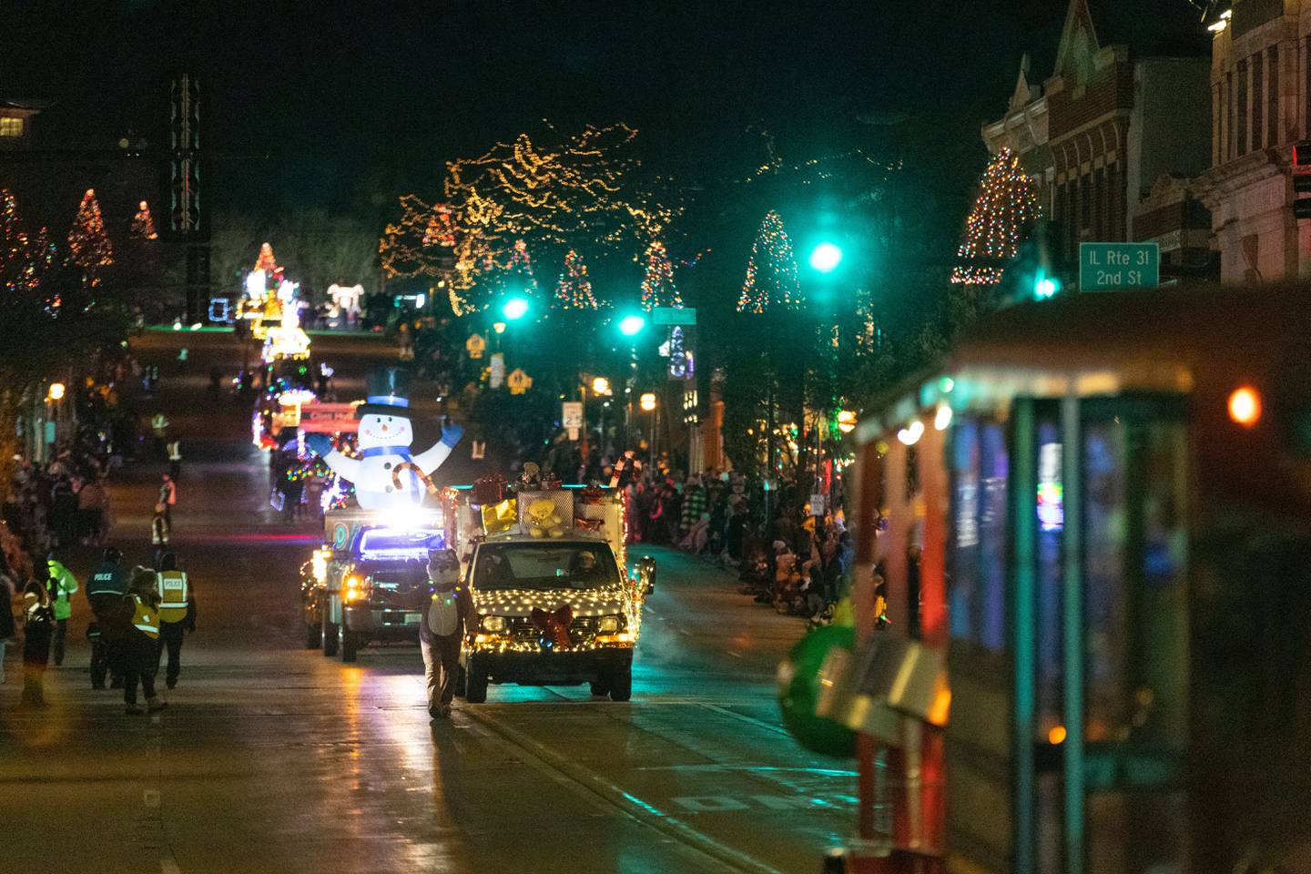 Floats process down Main Street in St. Charles during the Holiday Homecoming Electric Christmas Parade on Saturday, Nov. 30, 2024.