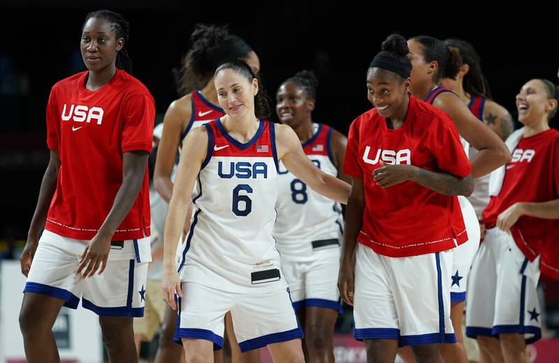 United States' Sue Bird (6) and teammates celebrate after their win in the women's basketball semifinal game against Serbia at the 2020 Summer Olympics, Friday, Aug. 6, 2021, in Saitama, Japan.