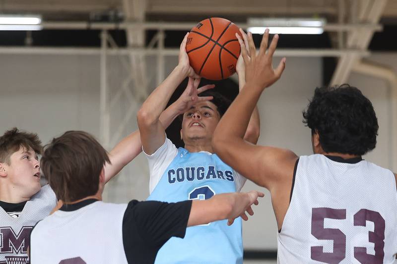 Plainfield South’s Caleb Mavarro draws the foul on the contested shot against Morris at the 37th Morris Boys Shootout on Tuesday, June 25, 2024.