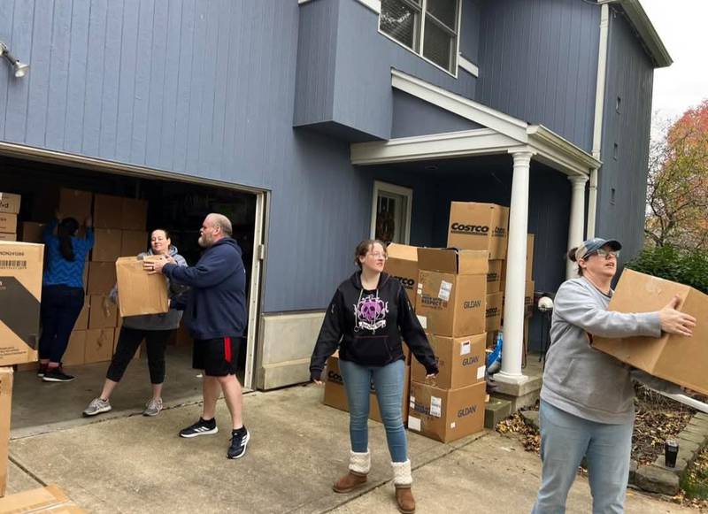Let's Ketchup volunteers prepare to deliver boxes of food and other essentials to local school Care Closets.